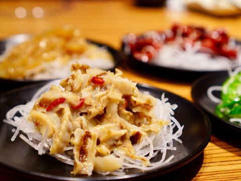 Delicious chuka hotate scallop trim appetizer served as an authentic Japanese side dish in a restaurant setting
