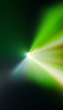 Bright green and white beam of light creating an abstract glowing