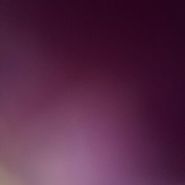 Abstract blurred purple gradient background with soft glow