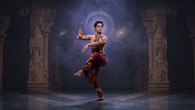 Indian Male Classical Dancer Performing Bharatanatyam in Temple Setting. Concept of indian classical dance, lord shiva pose, cosmic dance. Copy space.