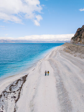 Stunning views of Salda Lake in Turkey with visitors exploring the sandy shores