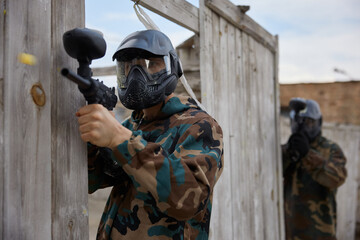 Fototapeta premium Portrait of a soldier practice with weapons on a training field