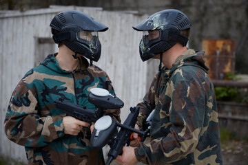 Fototapeta premium Two armed companions soldiers portrait on a training field