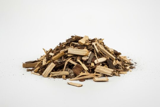 A pile of wood chips and bark mulch isolated on white background