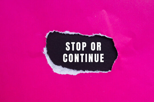 Stop or Continue text concept photo