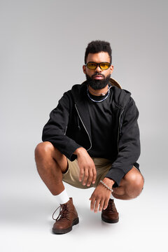 Handsome young man showcasing stylish comfort in relaxed urban setting