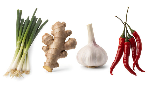Fresh spring onion, ginger root, garlic bulb and red chili peppers isolated on white.