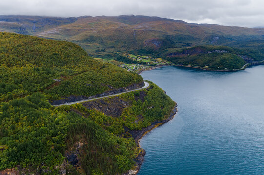 Coastal road and village beside a fjord in Northern Norway