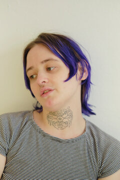 Closeup portrait of a cool person with colorful hair speaking 
