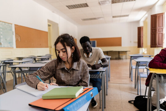 Diverse students studying in a university classroom