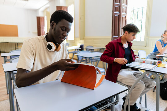 Young diverse students learning in a school classroom