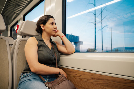 Passenger looking through train window