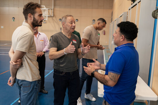 Diverse men networking communicating discussing ideas indoors