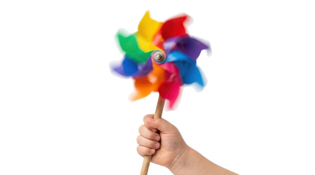 Childs hand holding a spinning rainbow pinwheel toy PNG Isolated on transparent background
