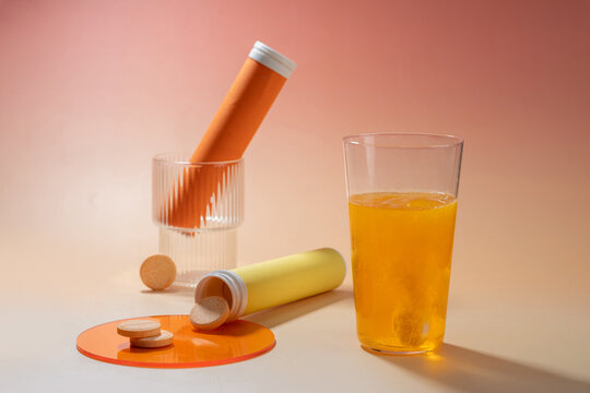 Effervescent tablets dissolving in a glass of water