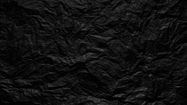 crumpled black paper texture dark wrinkled surface moody abstract background for web design branding and advertising layouts