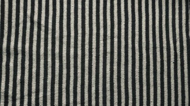 vertical black white striped knit fabric texture evoking cozy calm for minimalist web design background and branding