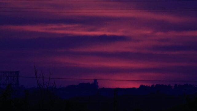 Partial solar eclipse at sunset over Rome skyline with Gasometer silhouette. Clip 08 - Sequence.