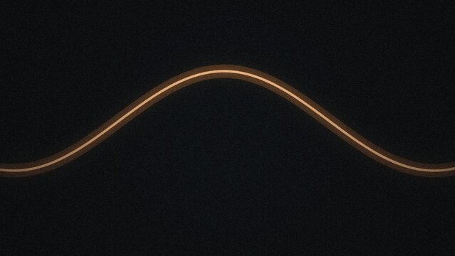A single glowing amber light trail forming a smooth horizontal sine wave curve against a dark black textured background surface