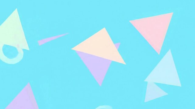 Abstract geometric pattern with colorful triangles floating on a soft light blue background for creative design