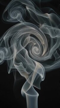 Abstract swirl of white smoke isolated on a solid black background.