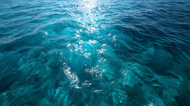 Crystal Clear Turquoise Ocean Water Surface with Sunlight Reflection