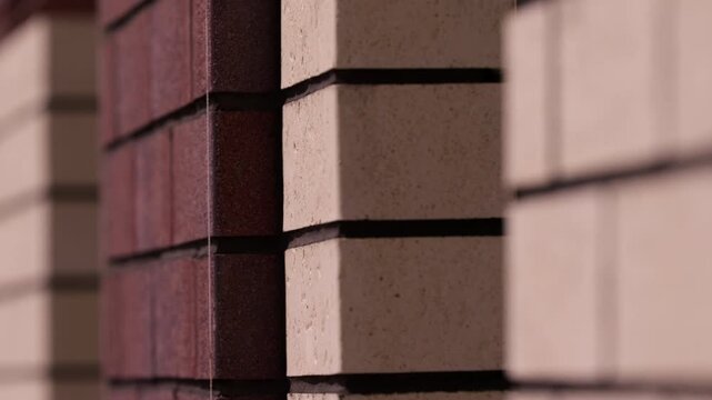 Contrasting red and beige brick walls on residential building facade
