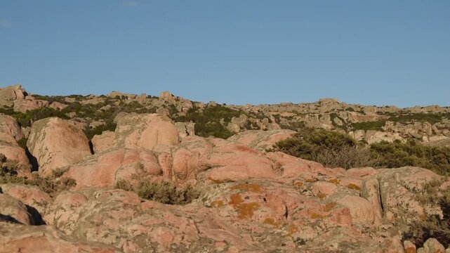View of the granite rocky landscape of La Maddalena Island at sunset, Sardinia, Italy.