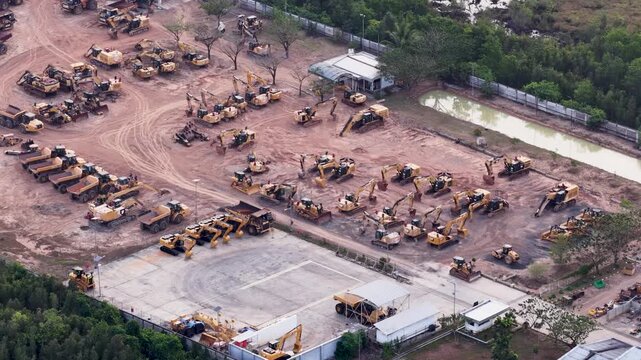 Rows of construction equipment and excavators parked on a rural work site in South Kalimantan