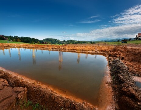 inspection scene with water damage revealing weak foundation and unstable soil conditions