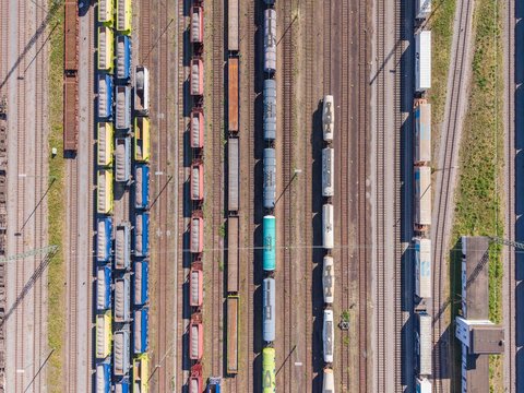 Karlsruhe, Germany - 29 July 2026: Aerial view of freight trains on multiple railway tracks in a logistics hub.