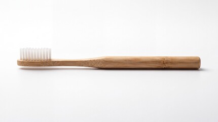 Naklejka premium Eco-friendly Bamboo Toothbrush: A minimalist bamboo toothbrush, showcasing sustainable design and natural material for conscious oral hygiene.