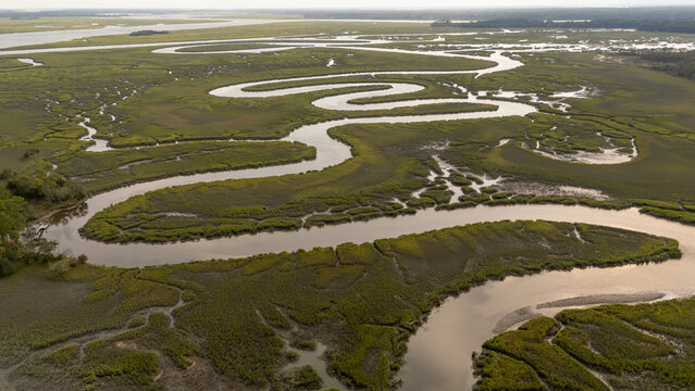 Drone view of winding waterways through lowcountry marshland in South Carolina during the day