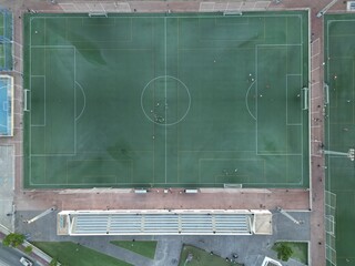 Aerial view football pitch with players practicing © Tororio Stock