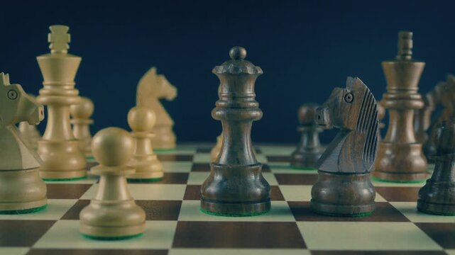 Man Moves Queen Playing Chess Closeup