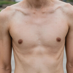Fototapeta premium Bare male torso with visible collarbones and chest, health and body image, skin texture and human anatomy
