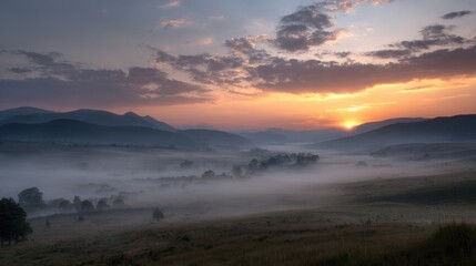 Naklejka premium Golden sunrise over misty valley with rolling hills with illuminating misty