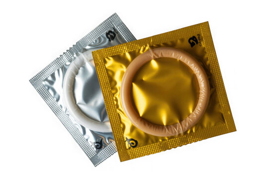 Two open condom packages one silver one gold showing protection and intimacy