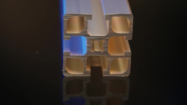 Close up of an aluminium extrusion profile with T slots and chambers