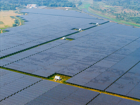 Mymensingh, Bangladesh - 30 January 2026: Aerial view of the HDFC SinPower Limited solar photovoltaic power plant with vast arrays of solar panels and electrical infrastructure.