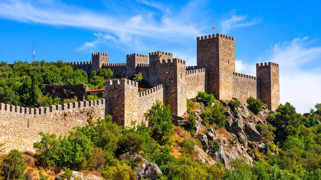 Medieval castle fortress on a hilltop against a blue sky