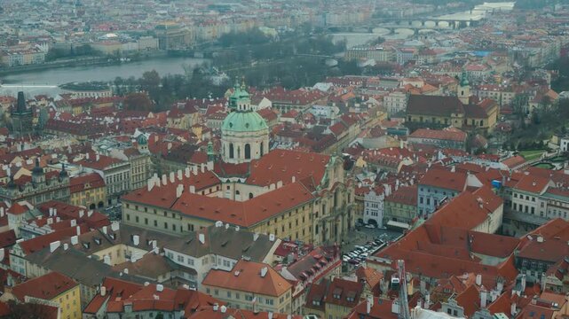 Captivating aerial view of a historic city characterized by colorful rooftops and intricate architecture. The image showcases the vibrancy of urban life, blending historical elements with a modern lan