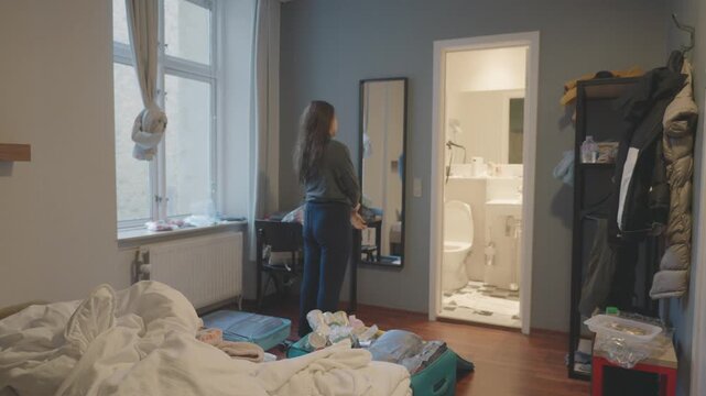 A cozy room featuring natural light, a mirror, and personal items. The atmosphere is relaxed, perfect for capturing everyday life moments in a domestic setting.