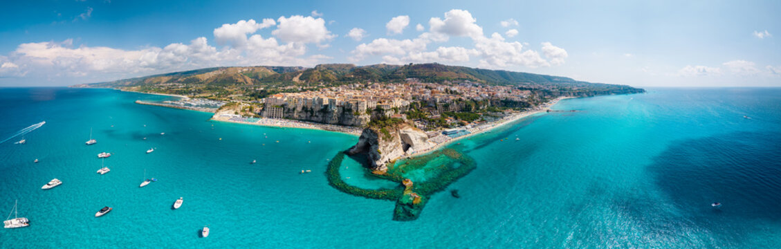 Tropea Calabria Italy panorama. Old town vertical cliffs above turquoise sea. Aerial drone view of Santa Maria dell Isola sanctuary surrounded by crystal clear water. high resolution wall art print