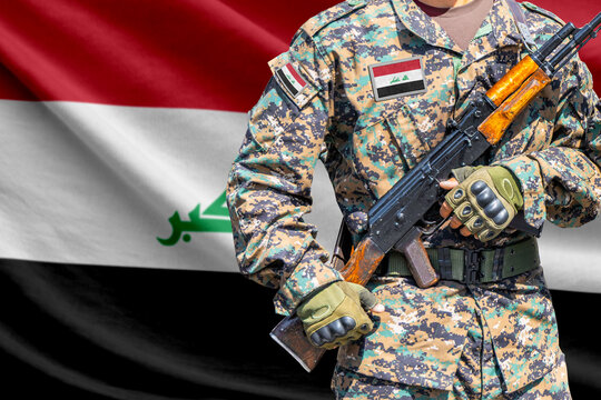 Iraq flag with soldier holding assault rifle