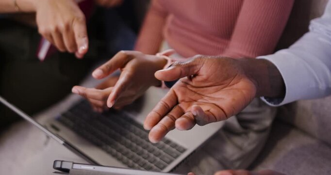 Pointing finger starting, group hands are aligning and tracing laptop and tablet on sofa working