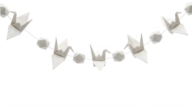 Paper origami crane garland hanging as a festive decoration