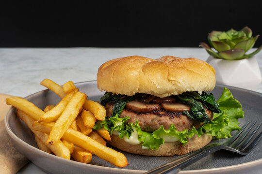 turkey mushroom  and spinach burger  with fries