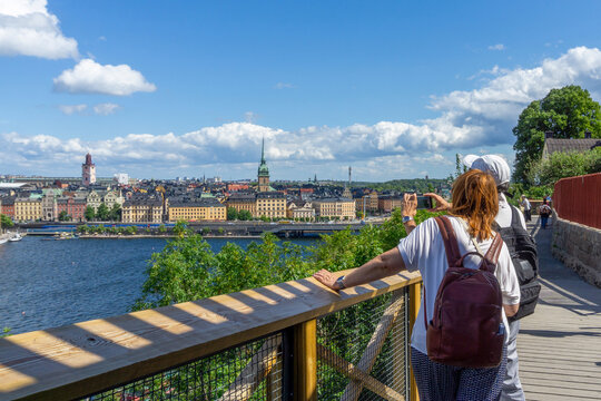 Tourists enjoying Stockholm city view from Monteliusv&auml;gen viewpoint