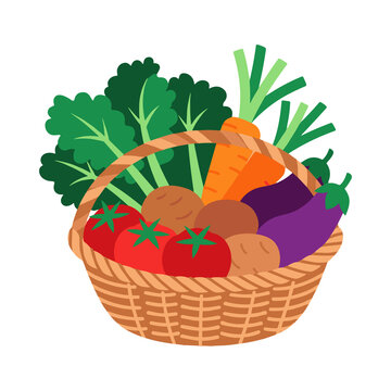 Wicker basket filled with fresh organic vegetables isolated on a white background